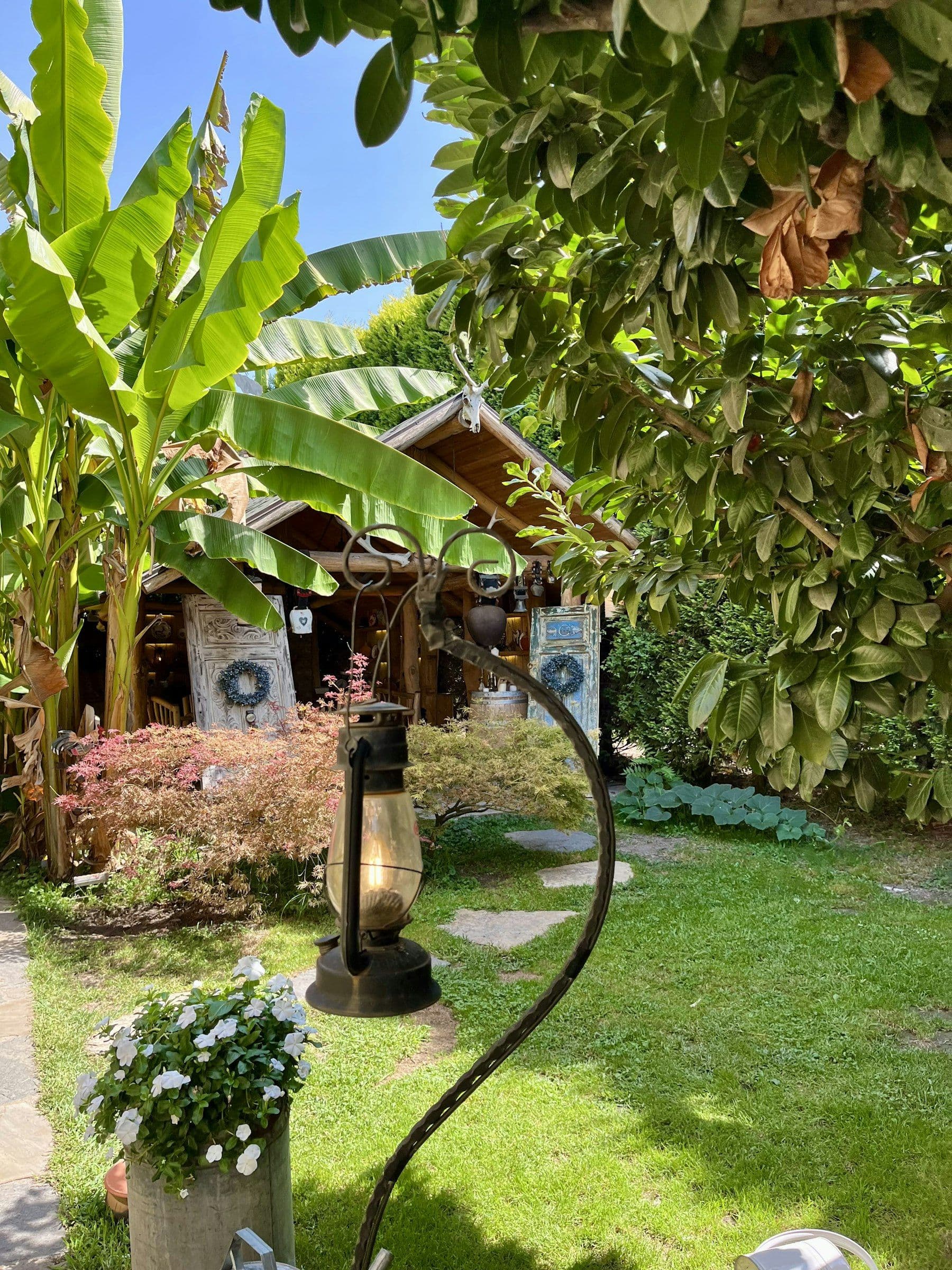 Illustrative image: wooden cabin in a lush garden