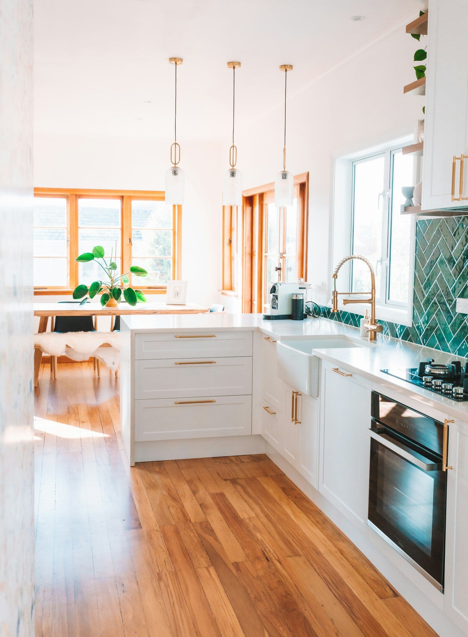 Illustrative image: kitchen with white cabinets and wood floors